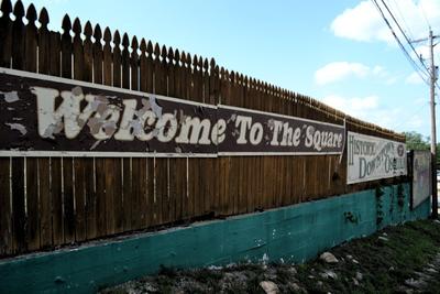 Welcome to Downtown Osceola written on a fence