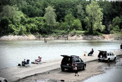 group of people fishing by the river