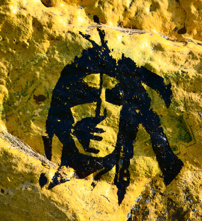 face painted on a rock